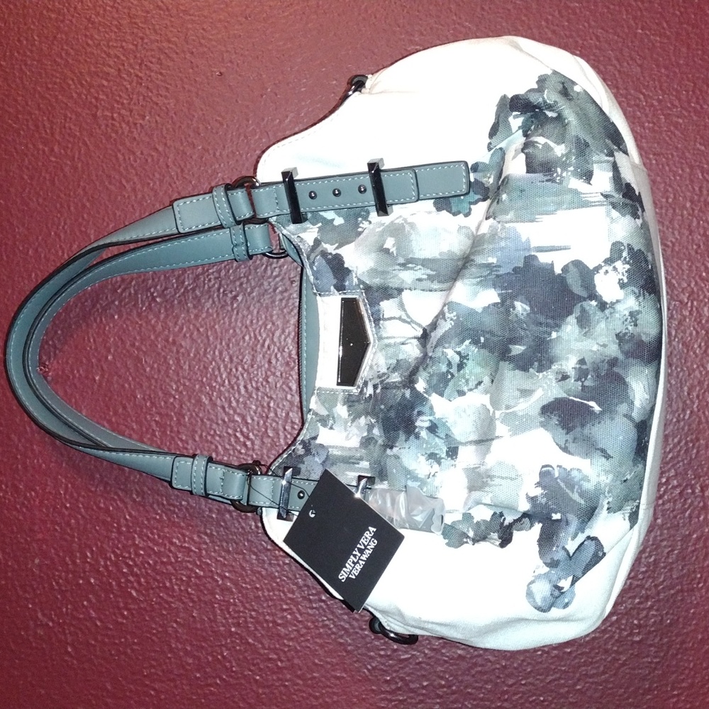 Vera Wang brand new purse with tags and protective plastic on strap.